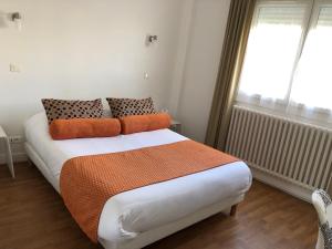 מיטה או מיטות בחדר ב-Cit'Hotel Atlantis