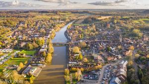 an aerial view of a city with a river at Corner Cottage in Bewdley