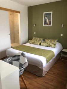 מיטה או מיטות בחדר ב-Cit'Hotel Atlantis