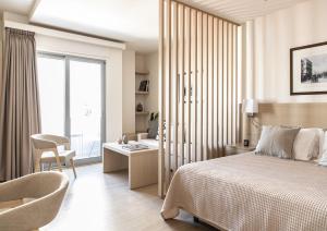 Gallery Suites & Residences Piraeus客房内的一张或多张床位