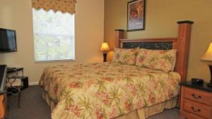 A bed or beds in a room at Luxury Contemporary Style Condo on Windsor Hills Resort, Orlando Condo 4850