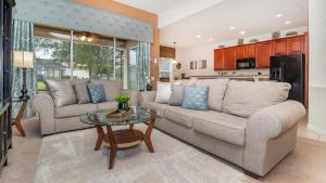 a living room with a couch and a table at Luxury Contemporary Style Villa on Windsor Hills Resort, Orlando Villa 4812 in Orlando