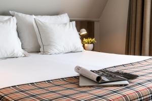 Cama o camas de una habitación en Hotel De Koepoort