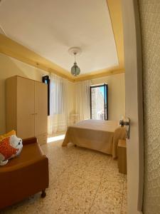 a large bedroom with a bed and a window at Maria Guesthouse in Morano Calabro