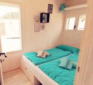 Ein Bett oder Betten in einem Zimmer der Unterkunft BUQEZ Villa 30 "Beachvilla Stella" mit SPA & Meerblick