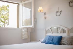 Llit o llits en una habitació de El Faro 8