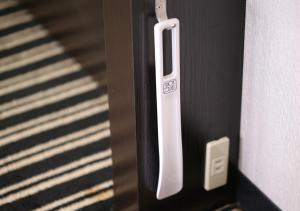 a close up of a door handle on a door at APA Hotel Shin Osaka Minamikata Ekimae in Osaka