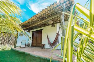 a patio of a house with a hammock at Ocacocar - Milagres in São Miguel dos Milagres +88 photos
