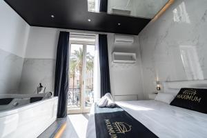 Katil atau katil-katil dalam bilik di Maximum Suite & Spa