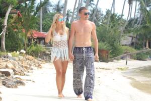 a man and a woman walking on the beach at Grand Sea Beach Resort in Haad Pleayleam +162 photos