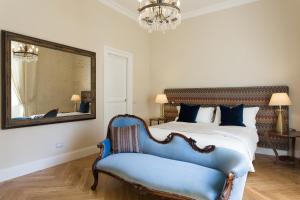 Postel nebo postele na pokoji v ubytování GMarconi Suites