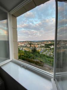 a window with a view of a city at Studio Apartment Villa Seiz in Schwäbisch Gmünd