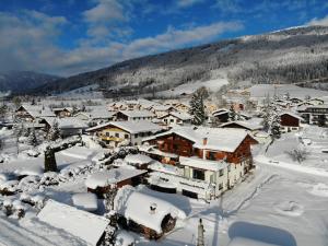 a small town covered in snow with houses at Wellnesshaus Reichelt in Radstadt