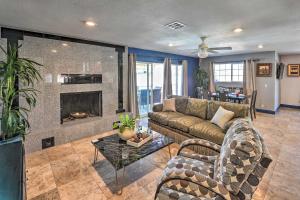 a living room with a couch and a fireplace at Elegant Home with Pool Table 3 Miles to The Strip! in Las Vegas