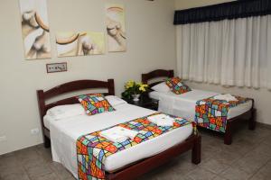 Säng eller sängar i ett rum på Grandes Lagos Park Hotel