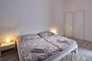 Posteľ alebo postele v izbe v ubytovaní Apartmán BB centrum