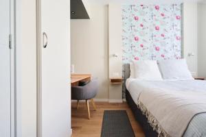 Кровать или кровати в номере Chez Hervé