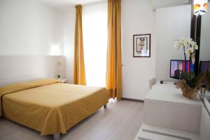 Postel nebo postele na pokoji v ubytování Hotel La Playa