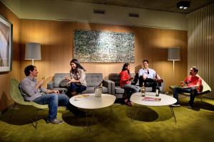 a group of people sitting in a waiting room at Boutique Apartments - San Telmo in Buenos Aires