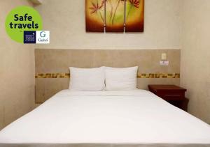 Hotel Guivá Huatulco 객실 침대