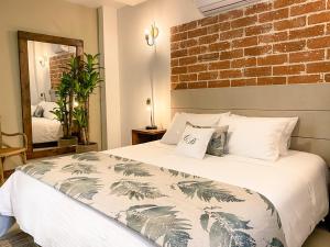 Кровать или кровати в номере Casa Bixa Hotel Boutique - Solo Adultos