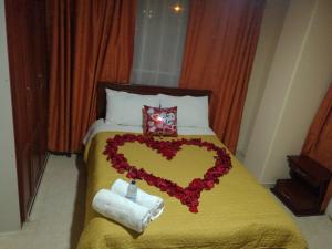 Postel nebo postele na pokoji v ubytování Hotel Suyusama
