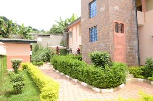 a garden in front of a building at Vegas House in Yaoundé
