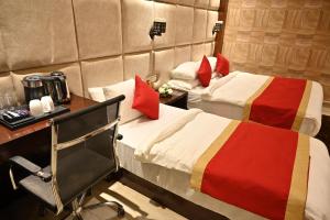 En eller flere senger på et rom på Hotel Aakriti Clarks Inn Express