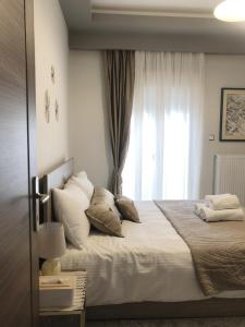 A bed or beds in a room at Xenia_Apartments A6