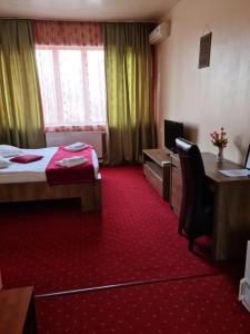 Voodi või voodid majutusasutuse Hotel Olimp toas