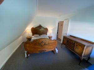 A bed or beds in a room at White Cottage