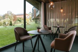 Area soggiorno di Floris Green Suites by Parc Hotel Florian