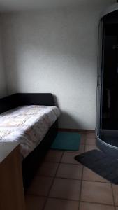 Postel nebo postele na pokoji v ubytování Chambre d'hotes du Tailfer