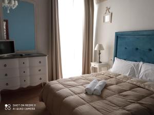 Posteľ alebo postele v izbe v ubytovaní B&B La Porta Vecchia