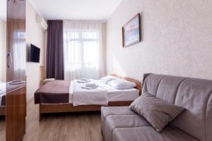 Säng eller sängar i ett rum på Гостевой дом "Дана" в 3 минутах от моря