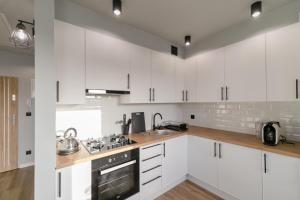 Kuchyň nebo kuchyňský kout v ubytování Apartament Skandynawski z balkonem - Dream Apart