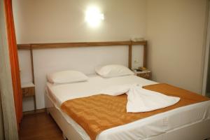 Postel nebo postele na pokoji v ubytování Özhan Hotel