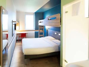 Ein Bett oder Betten in einem Zimmer der Unterkunft ibis budget Genève Aéroport