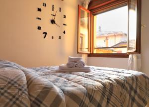 Postel nebo postele na pokoji v ubytování Emily House Vignola