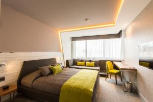 Postel nebo postele na pokoji v ubytování Zeniva Hotel