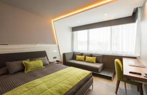 Postel nebo postele na pokoji v ubytování Zeniva Hotel
