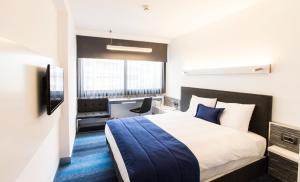 Postel nebo postele na pokoji v ubytování Zeniva Hotel