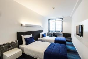 Postel nebo postele na pokoji v ubytování Zeniva Hotel