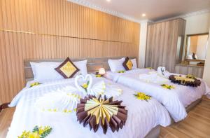 Postel nebo postele na pokoji v ubytování Anasia Hotel