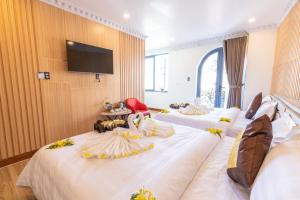 Postel nebo postele na pokoji v ubytování Anasia Hotel