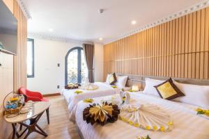 Postel nebo postele na pokoji v ubytování Anasia Hotel