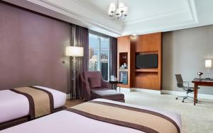 Katil atau katil-katil dalam bilik di Best Plaza West Bay Hotel