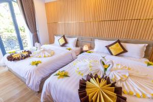 Postel nebo postele na pokoji v ubytování Anasia Hotel