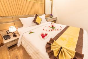 Postel nebo postele na pokoji v ubytování Anasia Hotel