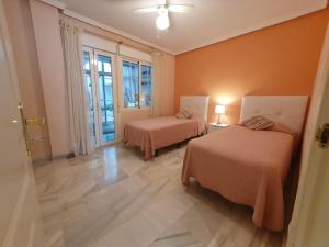 Posteľ alebo postele v izbe v ubytovaní Townhouse Mar y Sol
